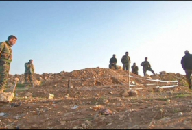 Un team unearths 12 mass graves in Iraq probe of isis criems 